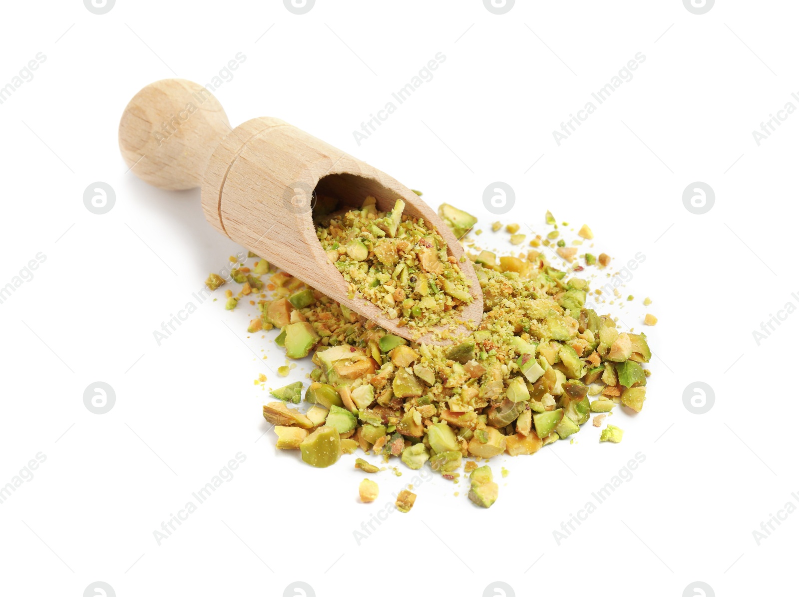 Photo of Pieces of peeled pistachio nut in wooden scoop isolated on white