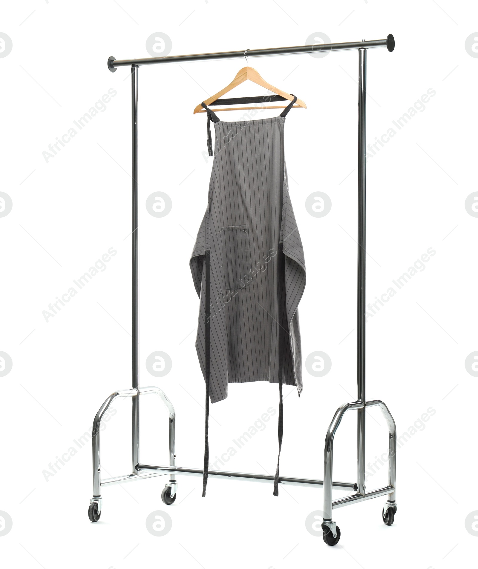 Photo of Chef's apron on clothing rack isolated on white