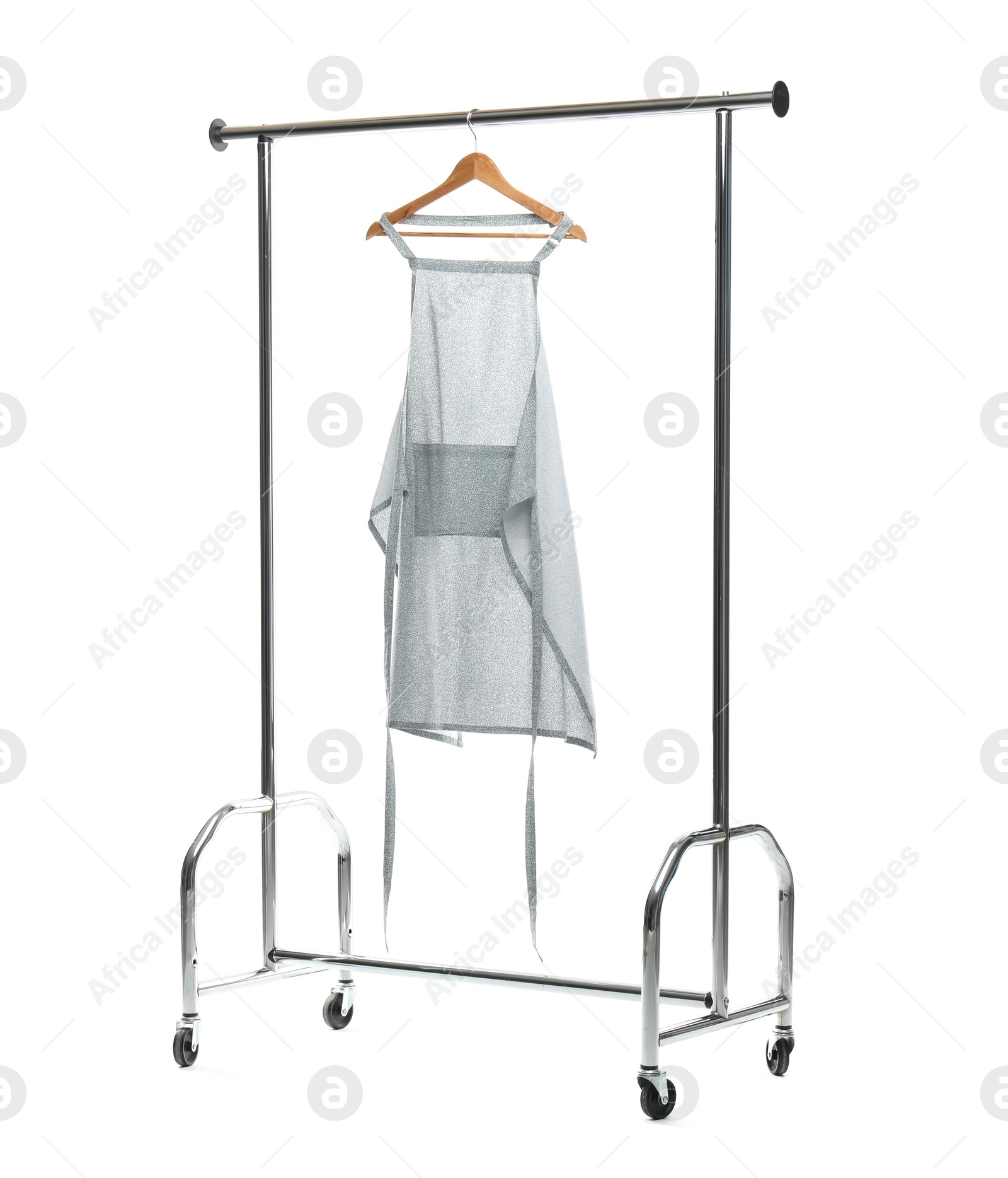 Photo of Chef's apron on clothing rack isolated on white