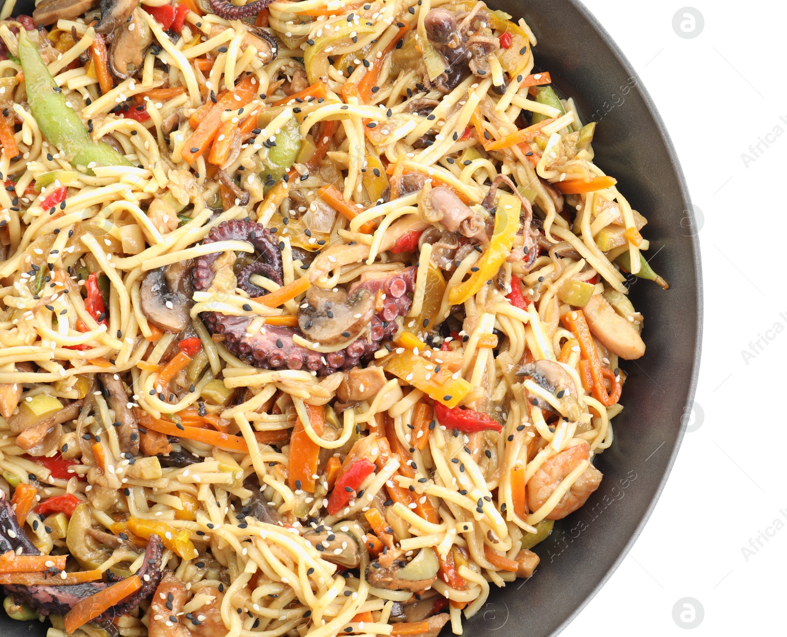 Photo of Stir-fry noodles with sea food and vegetables in wok isolated on white, top view