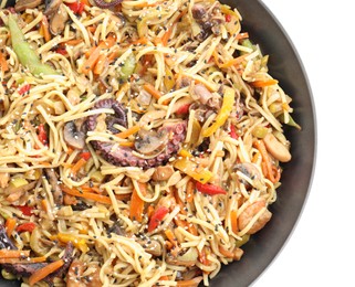 Photo of Stir-fry noodles with sea food and vegetables in wok isolated on white, top view