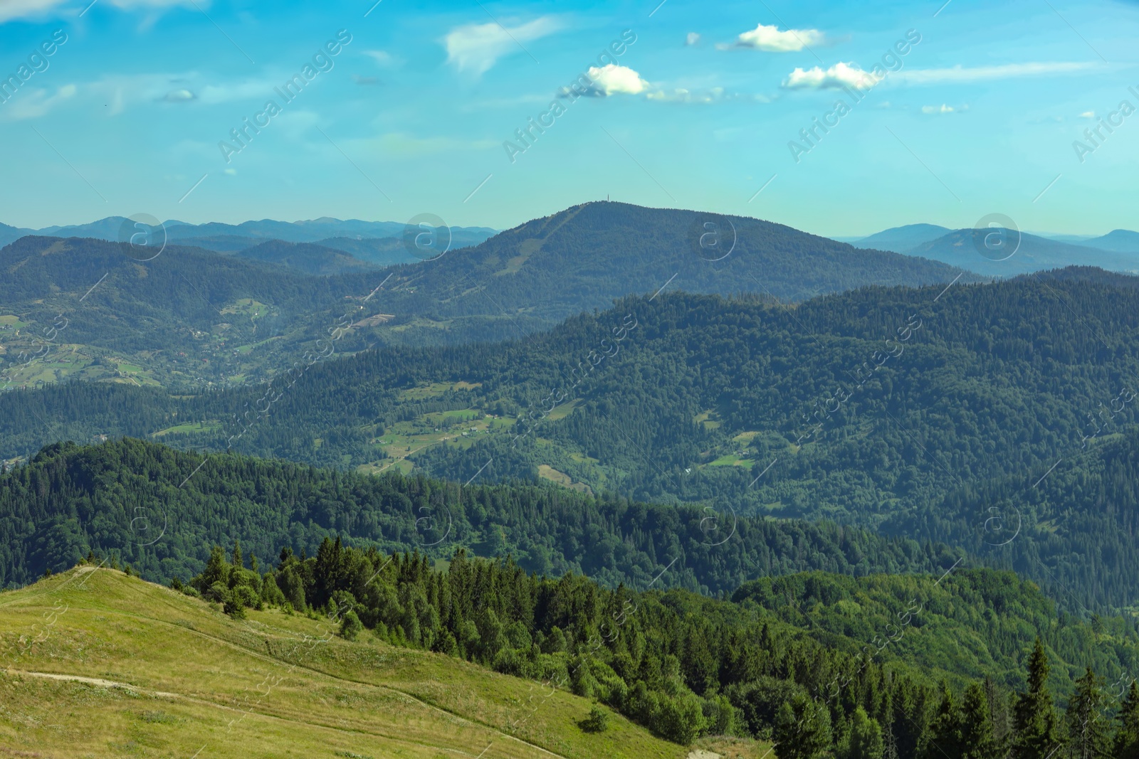 Photo of Picturesque view of mountains with trees under sky