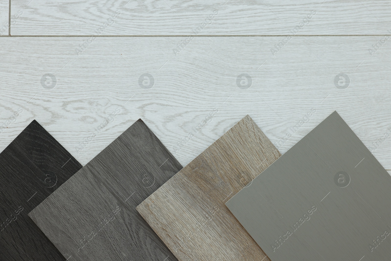 Photo of Different samples of wooden flooring indoors, top view