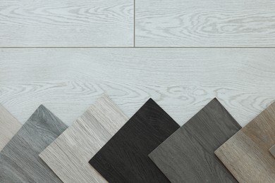 Photo of Different samples of wooden flooring indoors, top view