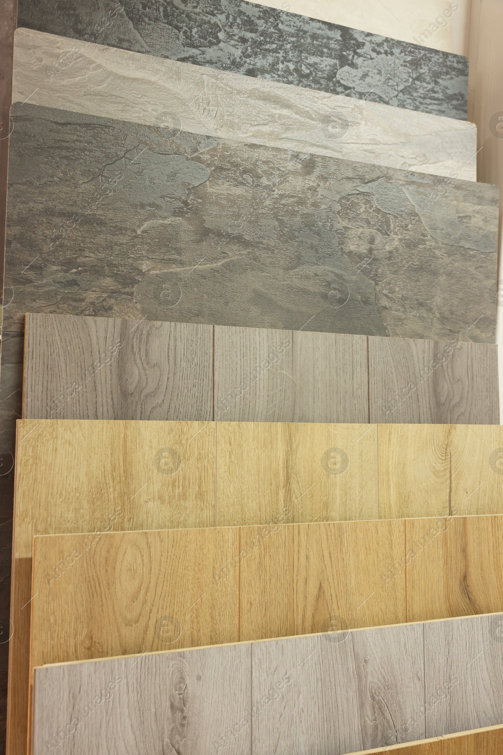 Photo of Many different samples of wooden flooring in store