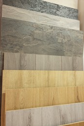 Photo of Many different samples of wooden flooring in store