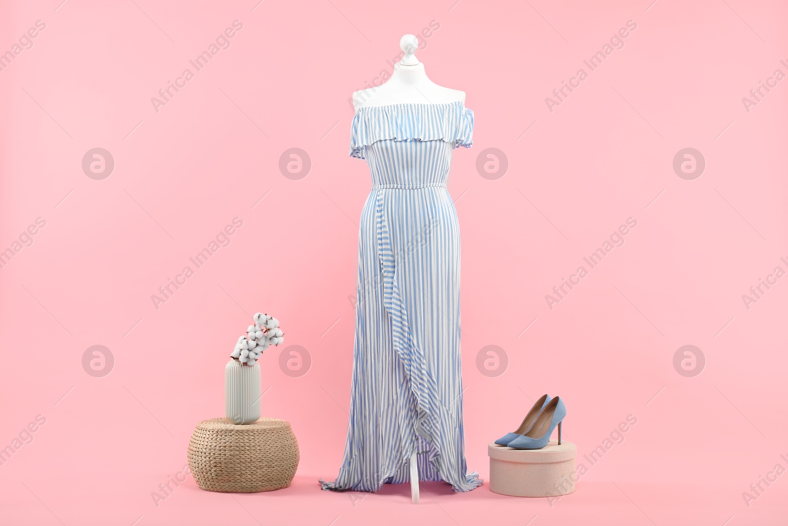 Photo of Mannequin with stylish dress and shoes on pink background