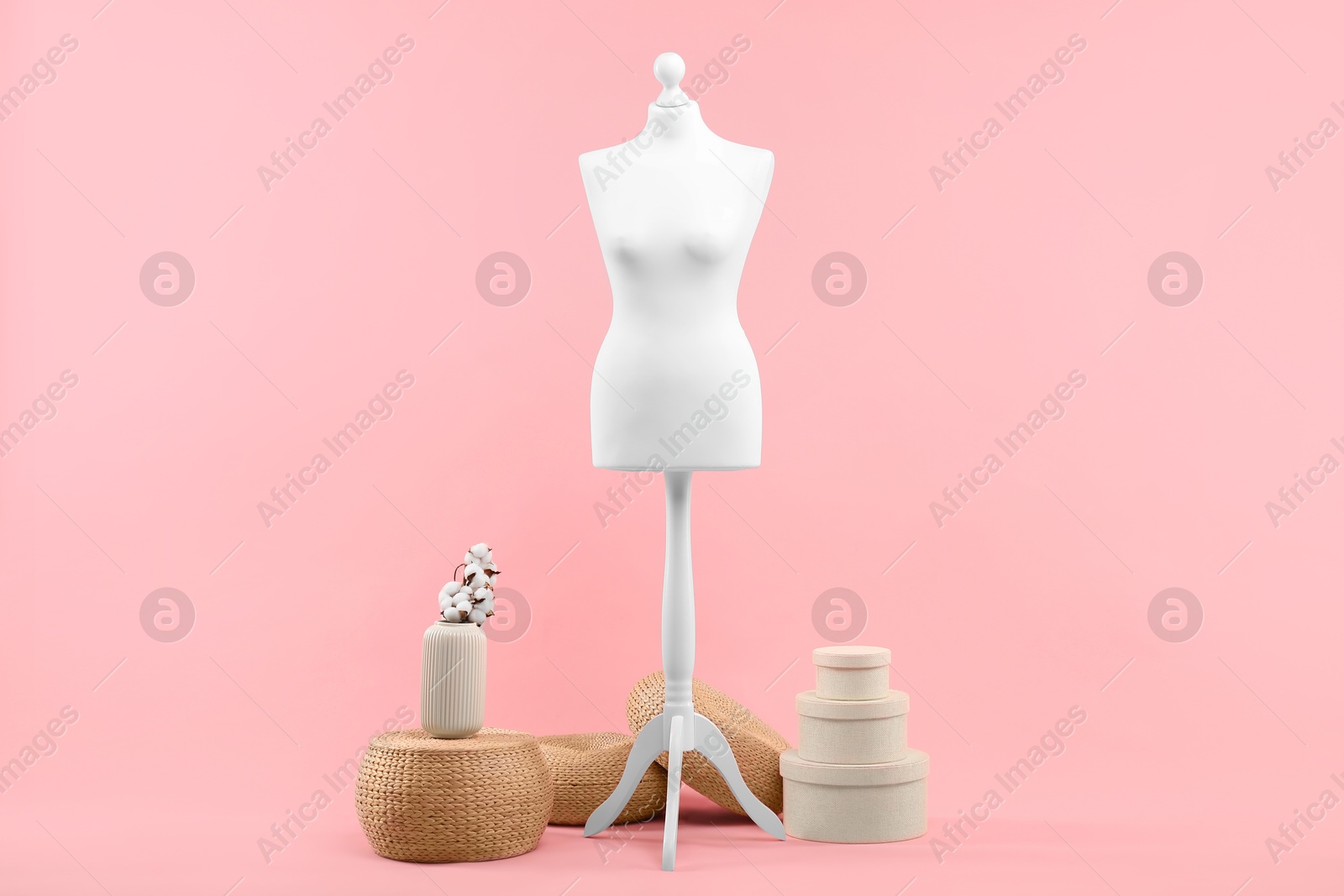 Photo of Mannequin and stylish vase on pink background