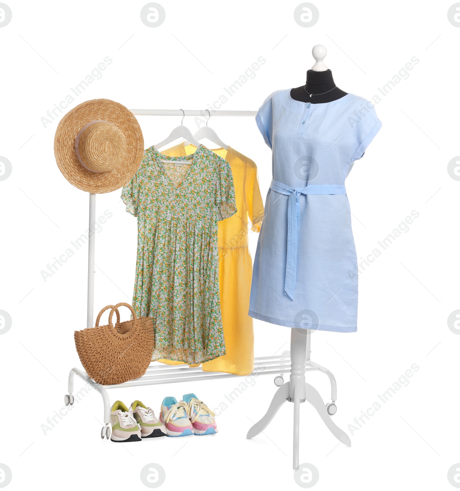 Photo of Female mannequin with stylish light blue dress other clothes isolated on white