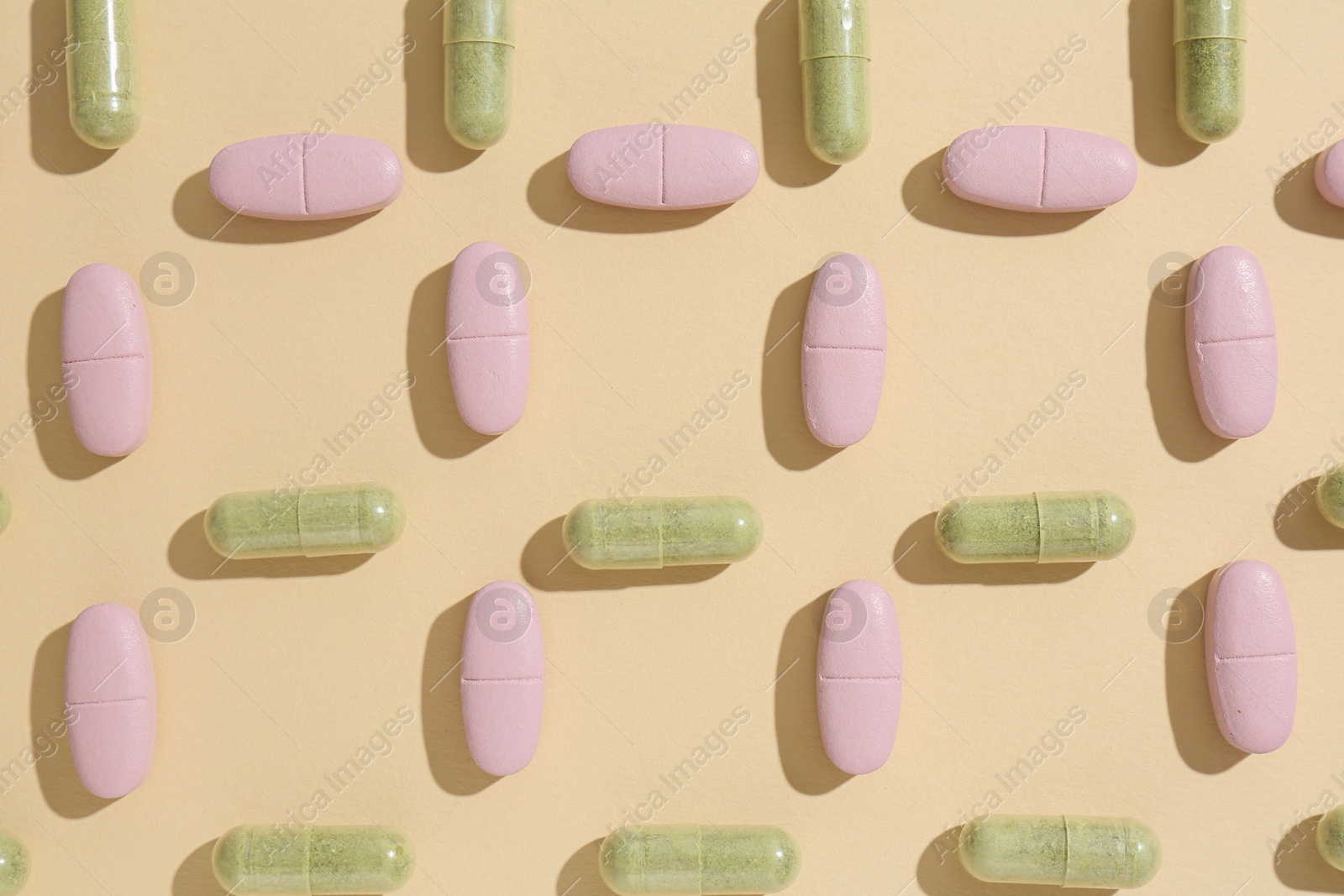 Photo of Pharmacist concept. Many different pills on beige background, flat lay