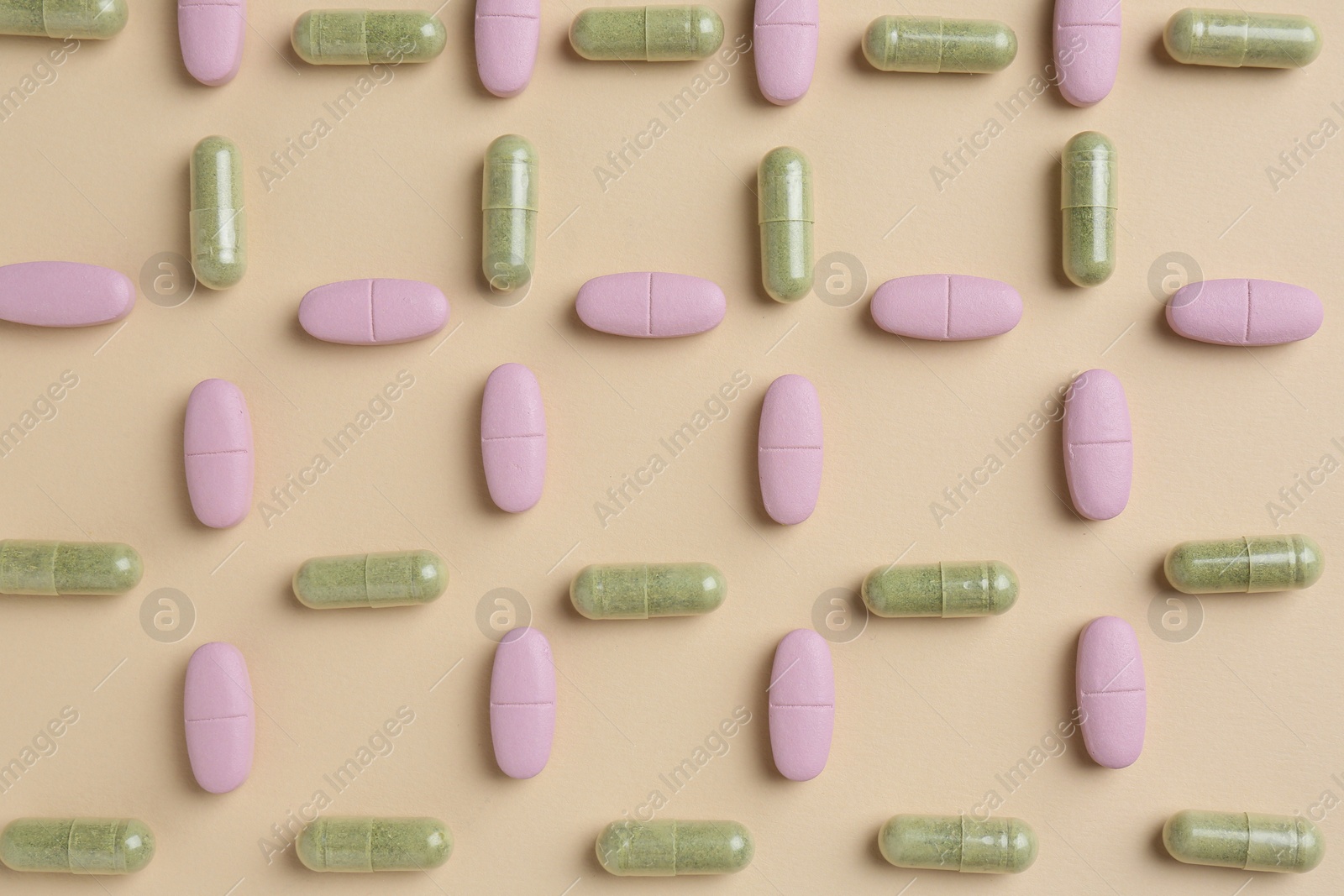 Photo of Pharmacist concept. Many different pills on beige background, flat lay