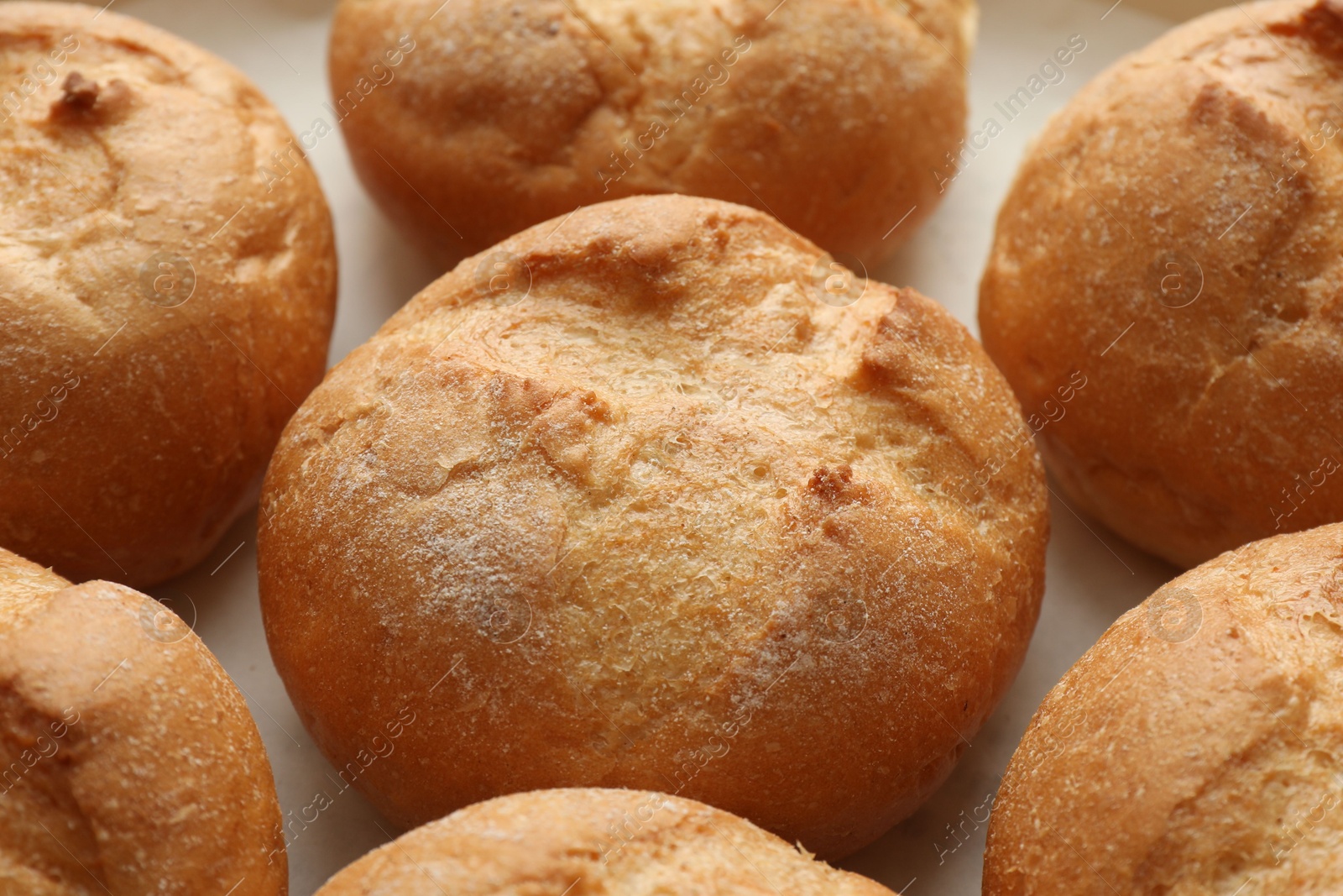 Photo of Homemade tasty buns in baking dish, closeup