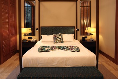 Comfortable large bed in stylish hotel room