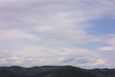 Beautiful view of forest in mountains under blue sky