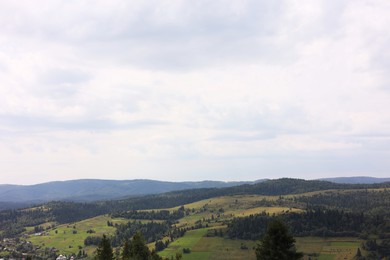 Photo of Beautiful view of forest in mountains under blue sky