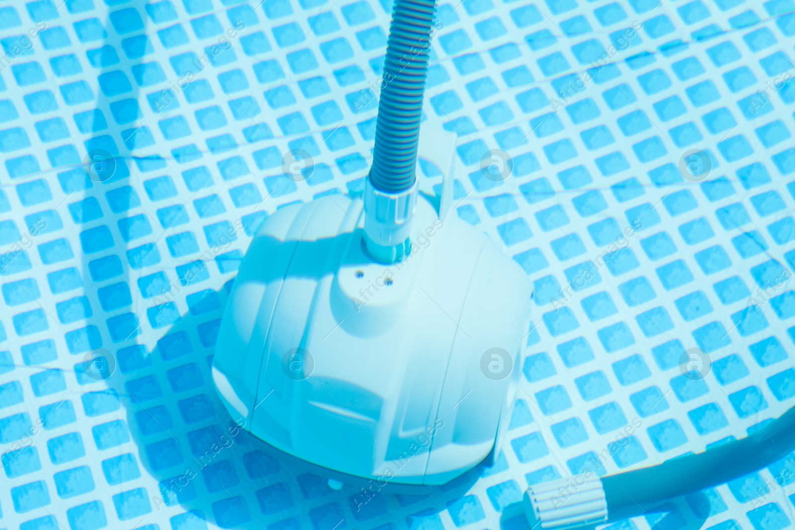 Photo of One robotic cleaner in swimming pool outdoors