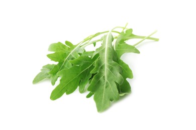 Photo of Many fresh arugula leaves on white background