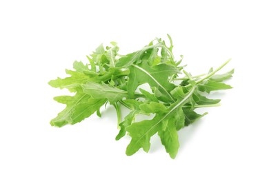 Photo of Many fresh arugula leaves isolated on white