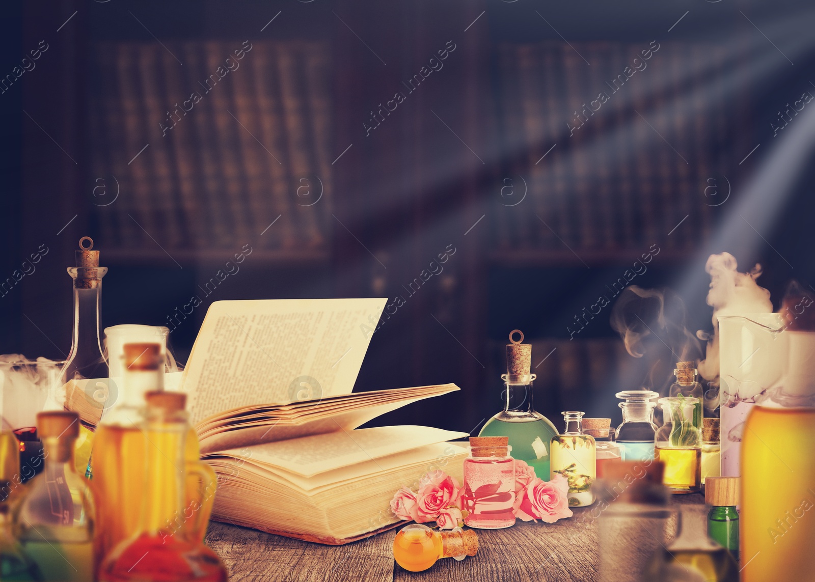 Image of Chemist's workplace with old book and laboratory glassware, vintage style