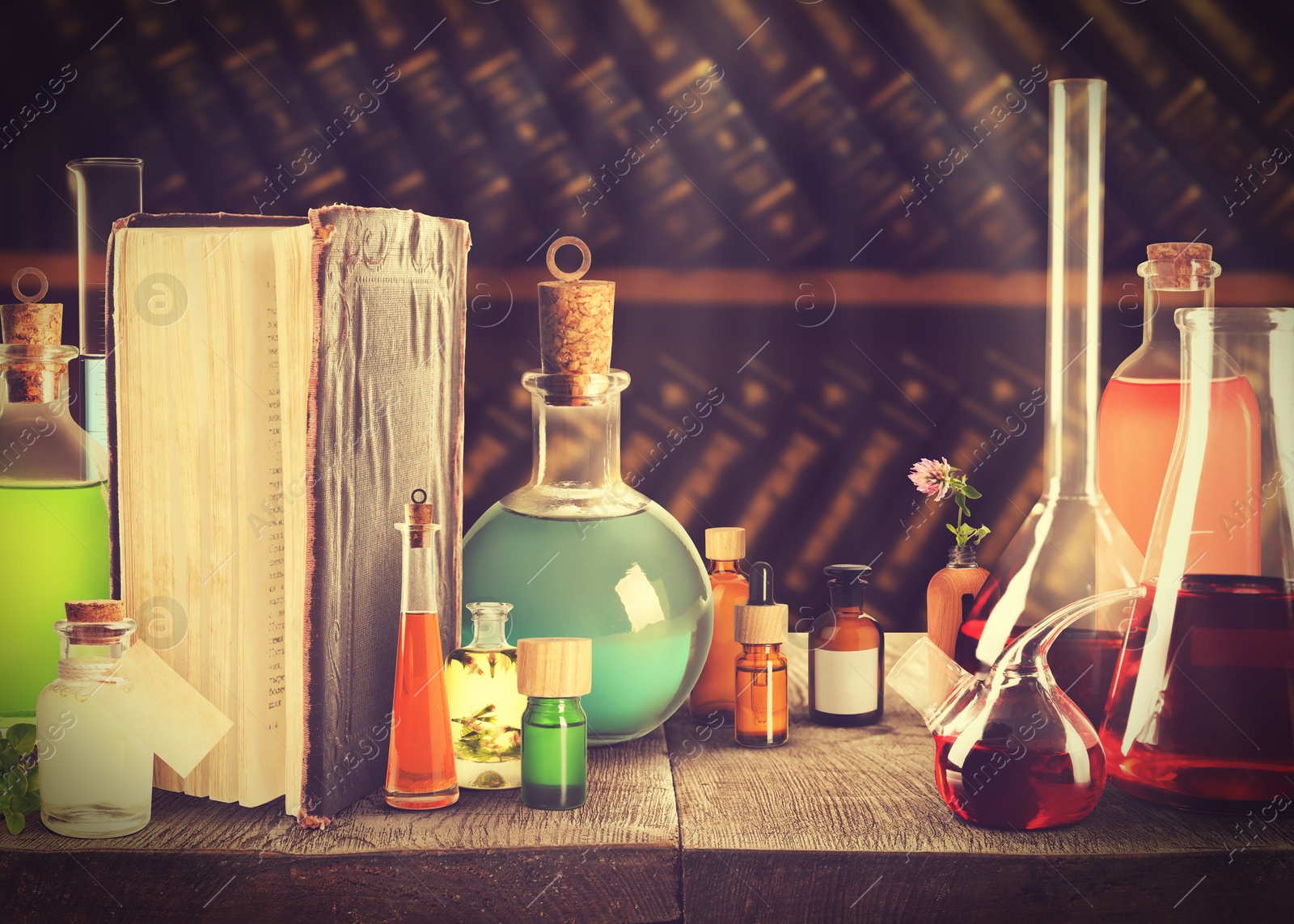 Image of Chemist's workplace with old book and laboratory glassware, vintage style