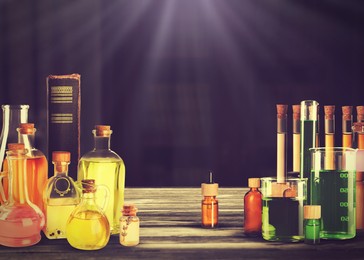 Image of Chemist's workplace with old book and laboratory glassware, vintage style