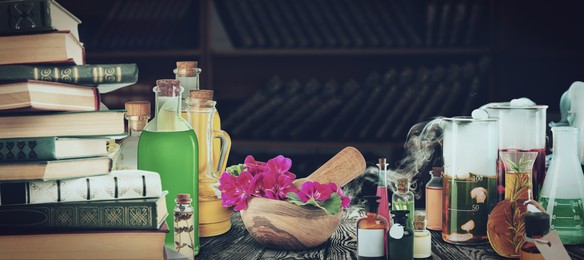 Image of Chemist's workplace with old books and laboratory glassware, vintage style. Banner design