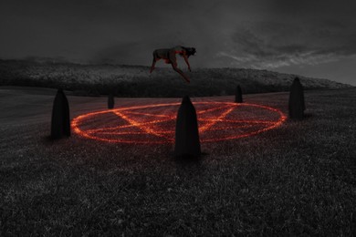 Image of Terrifying ritual. Woman with glowing eyes levitating over pentagram surrounded by cultists in meadow