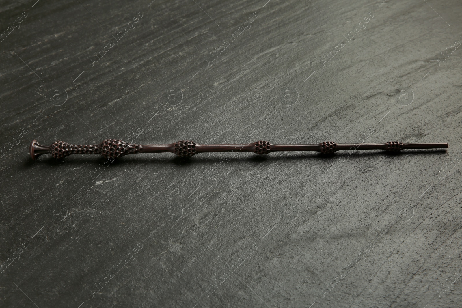 Photo of One old magic wand on black table