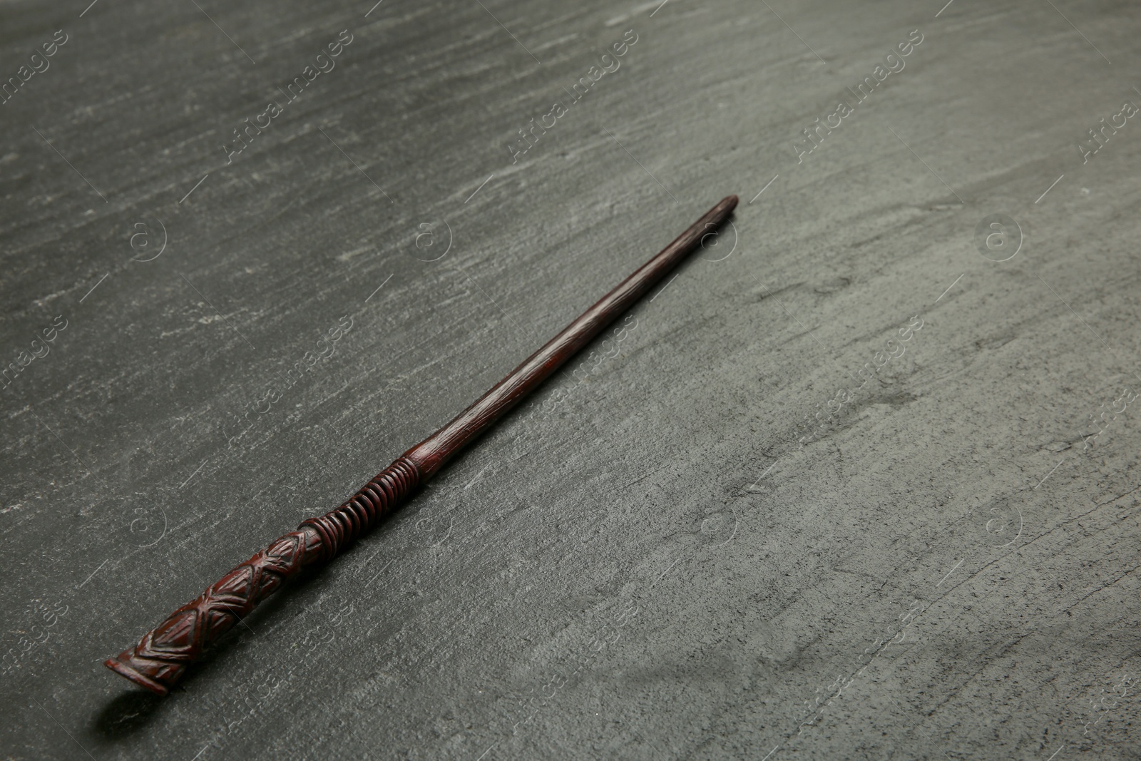 Photo of One old magic wand on black table