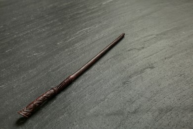 Photo of One old magic wand on black table