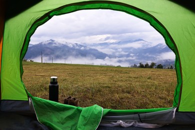 Picturesque view of mountain from green tent