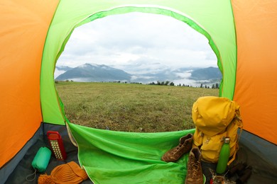 Picturesque view of mountains from green tent