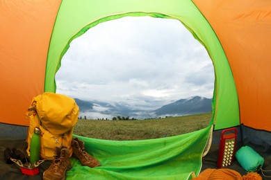 Picturesque view of mountains from green tent