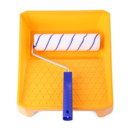 Photo of Paint roller brush and yellow plastic tray isolated on white, above view. Construction tool