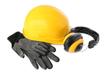 Photo of Yellow hard hat, gloves and earmuffs isolated on white. Safety equipment