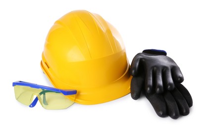 Yellow hard hat, gloves and goggles isolated on white. Safety equipment