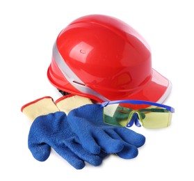 Photo of Orange hard hat, gloves and goggles isolated on white. Safety equipment