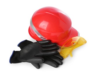 Orange hard hat, gloves and goggles isolated on white. Safety equipment