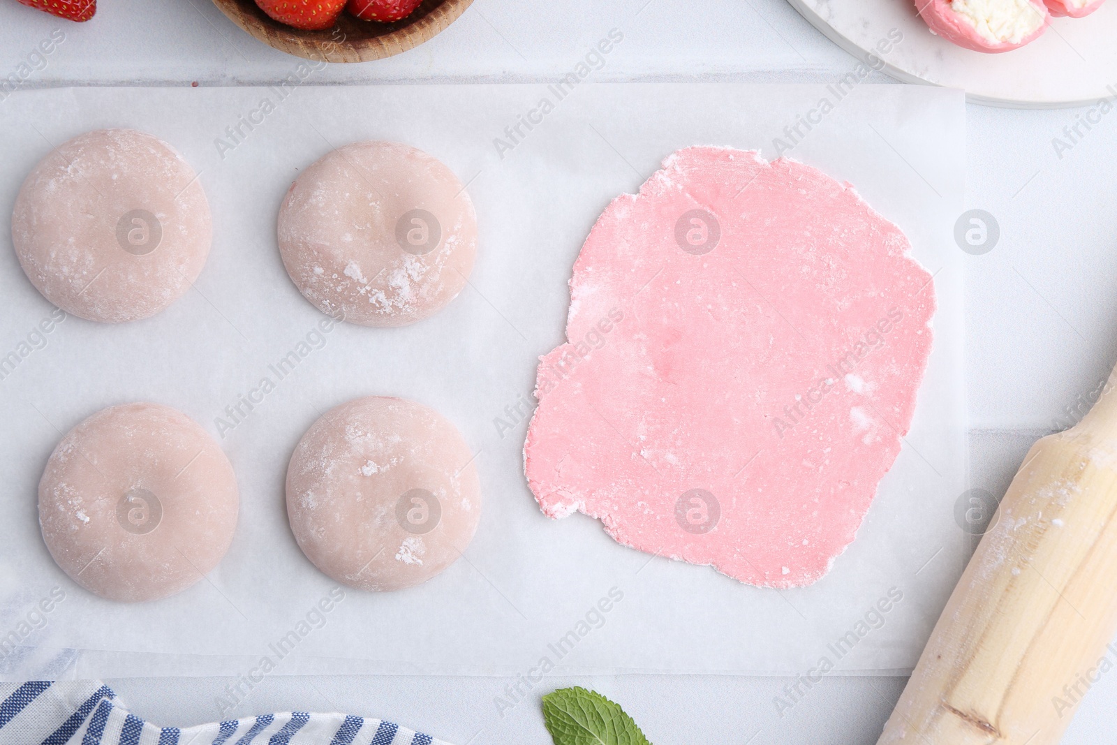 Photo of Tasty homemade mochi, dough on white table, top view