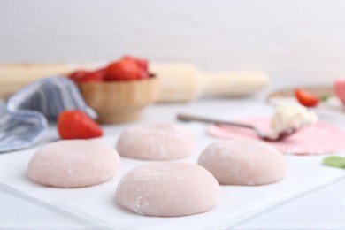 Photo of Tasty homemade mochi on white table, closeup