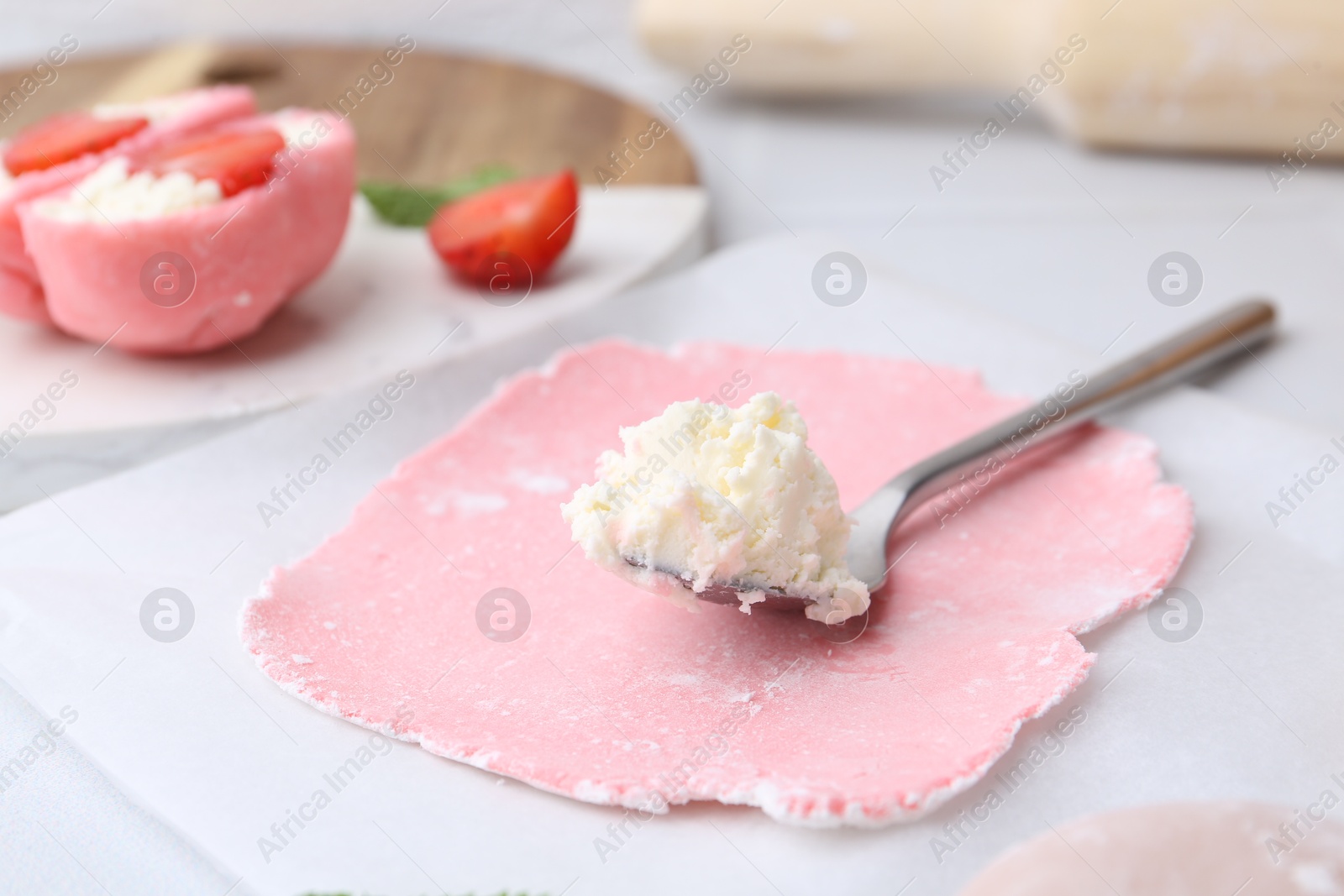 Photo of Dough for tasty homemade mochi and cream on table, closeup