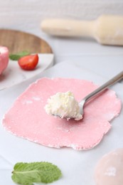 Photo of Dough for tasty homemade mochi and cream on table, closeup