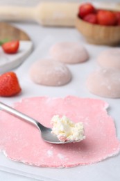 Photo of Dough for tasty homemade mochi and cream on table, closeup