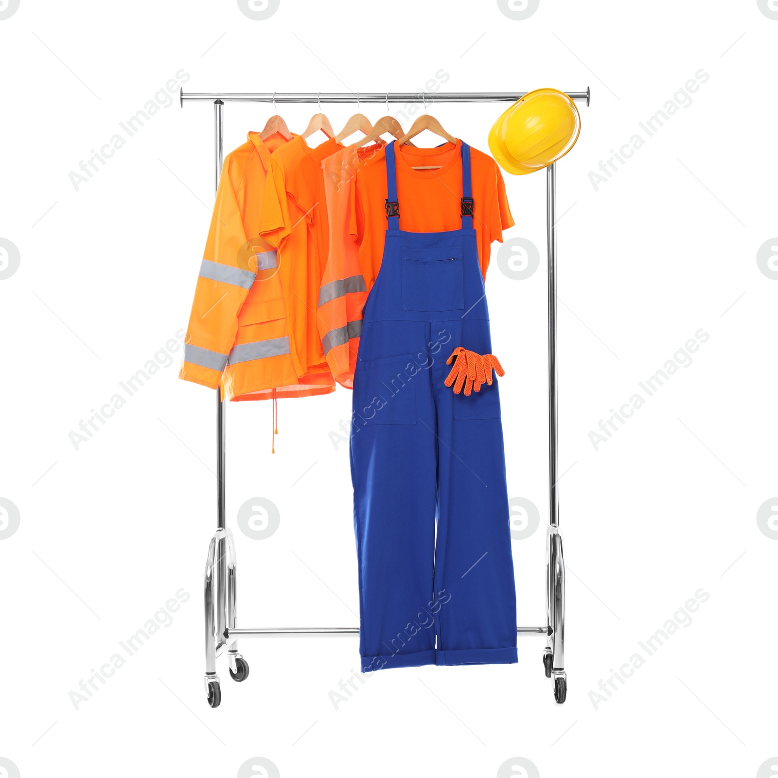 Photo of Workers' uniforms on clothing rack isolated on white