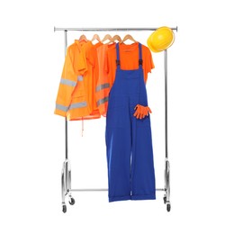 Photo of Workers' uniforms on clothing rack isolated on white