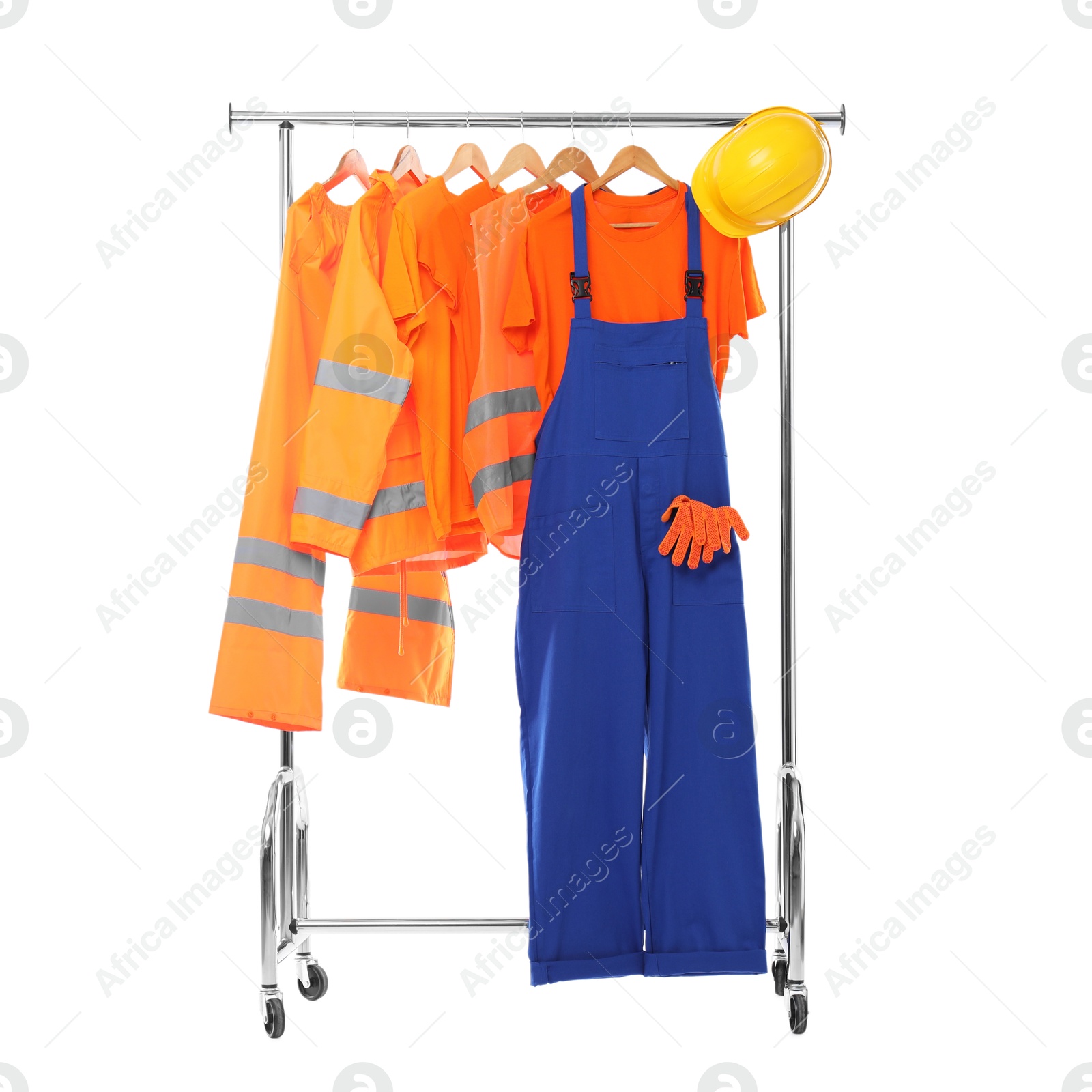 Photo of Workers' uniforms on clothing rack isolated on white