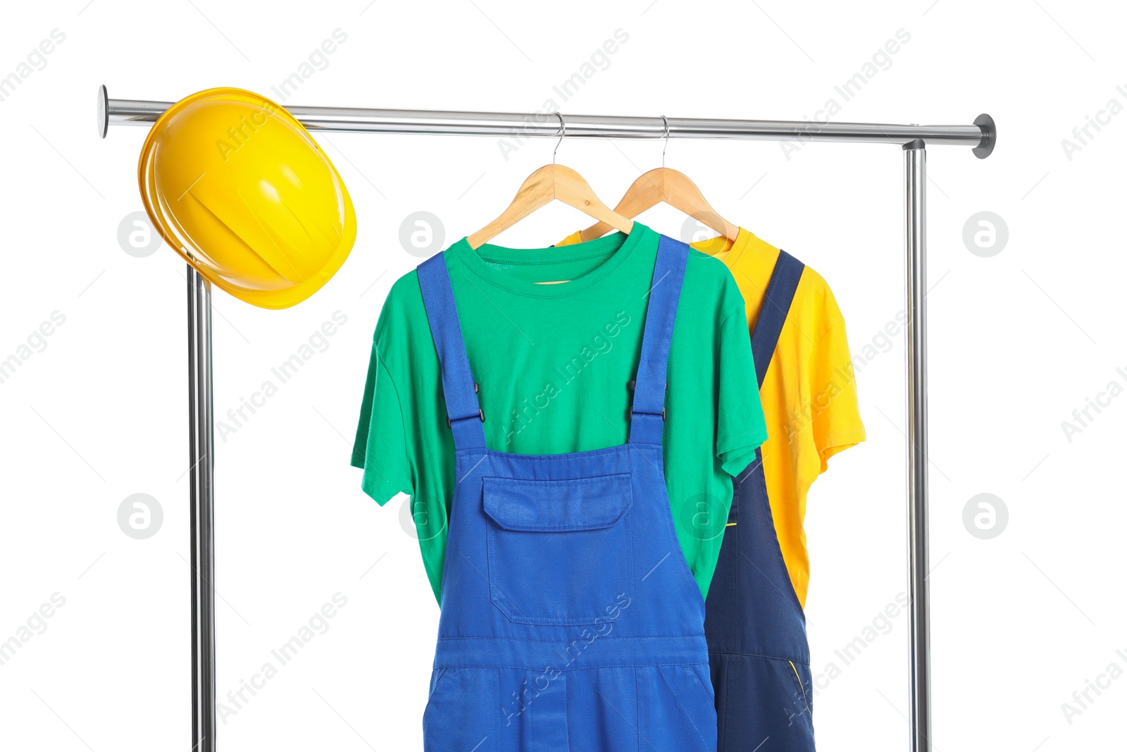 Photo of Workers' uniforms on clothing rack isolated on white