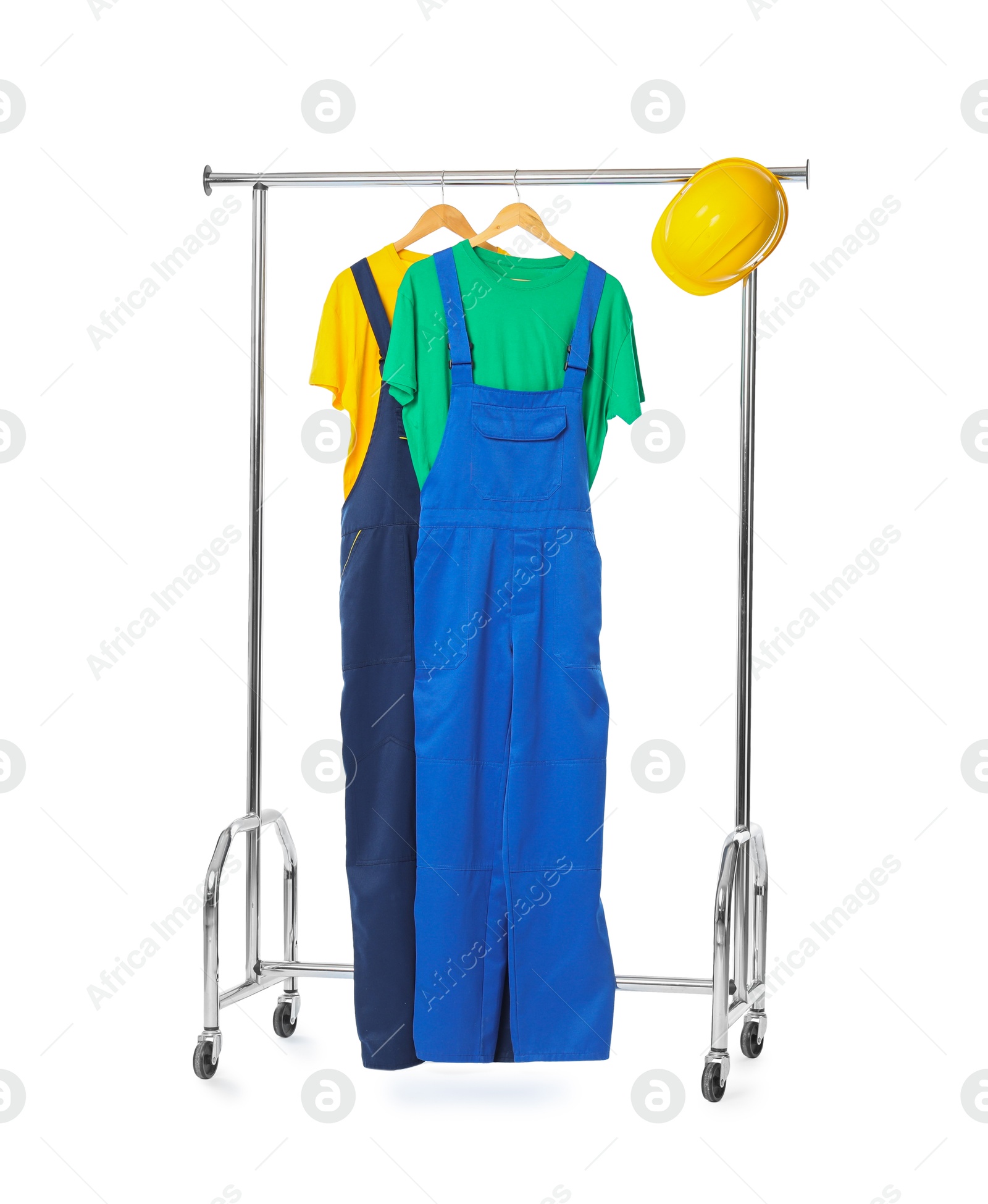 Photo of Workers' uniforms on clothing rack isolated on white