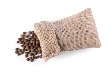 Photo of Burlap sack with allspice isolated on white, top view