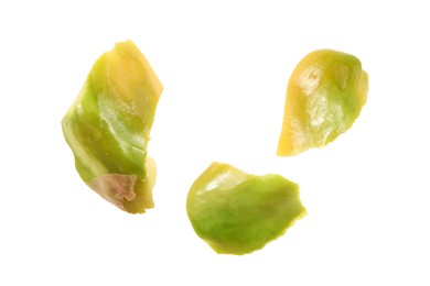 Pieces of peeled pistachio nut isolated on white